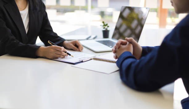 Two people reviewing employment history conversation