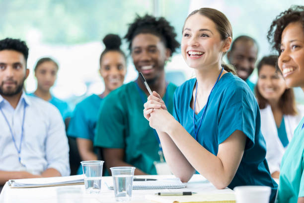 Medical Students at a table with notebooks and pens