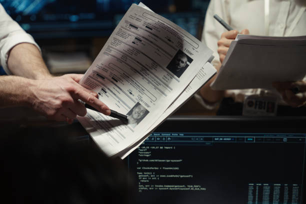 Man pointing to criminal charge on sheet of paper.