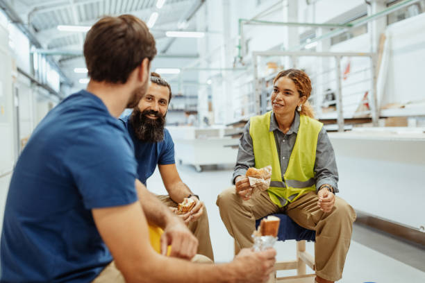 Three employees eating lunch at work