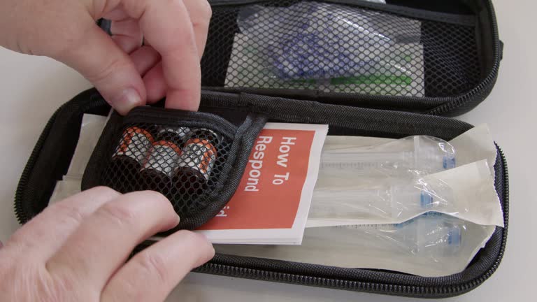 Vial of naloxone medication used for opioid overdose removed from kit