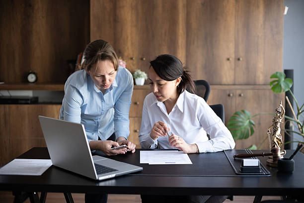 Employee and employer looking over signed document